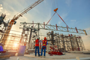 Workers on a commercial construction site building a modern office complex.